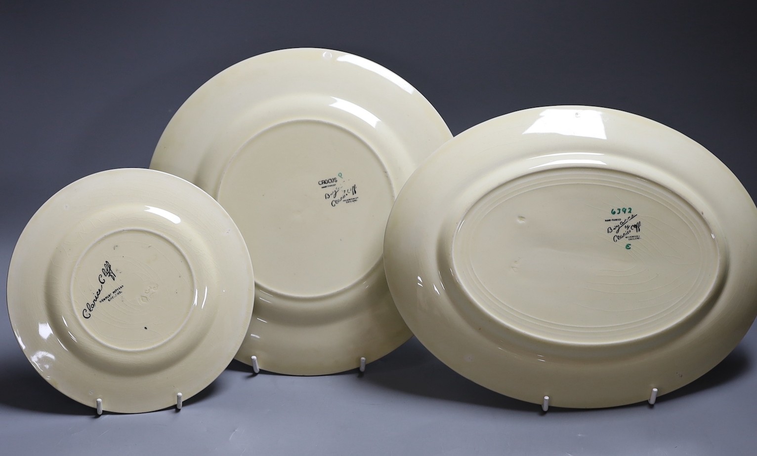 Clarice Cliff Sungleam, three crocus pattern plates